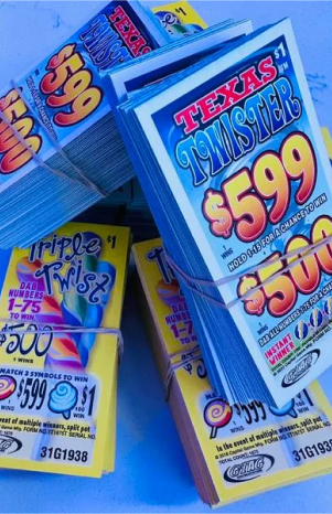 The bundles of Texas lottery tickets, labeled 'Texas Twister and Triple Twist, with prize amounts of $599 and $500, respectively.
